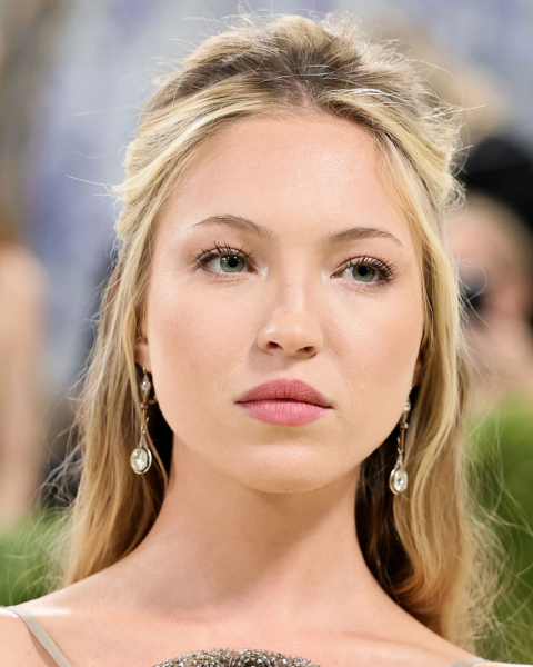 Closeup of a woman with matte skin makeup.